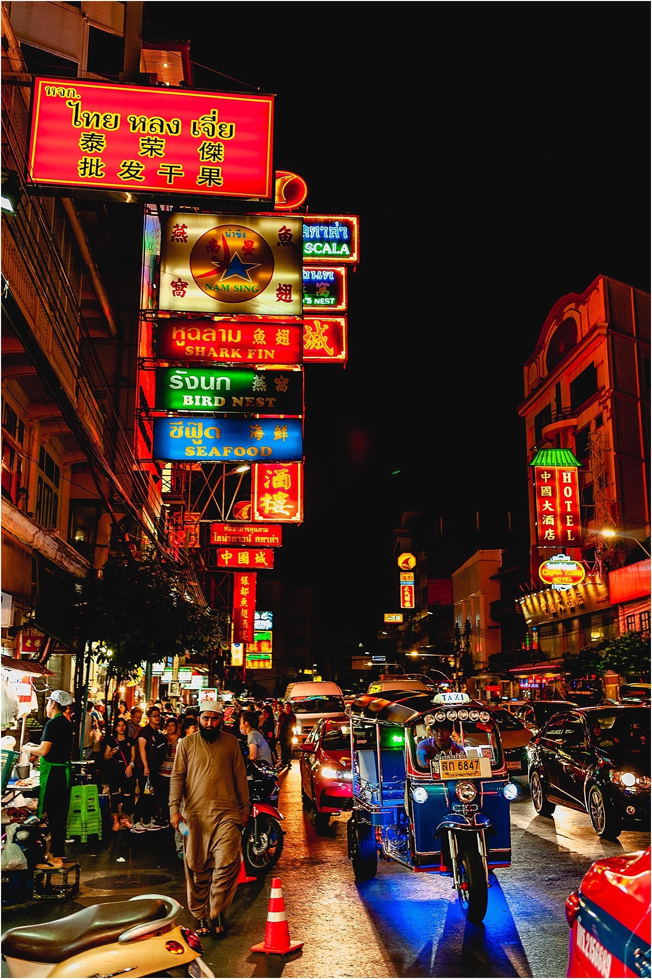Chinatown in Bangkok by night with neon signs lining the streets