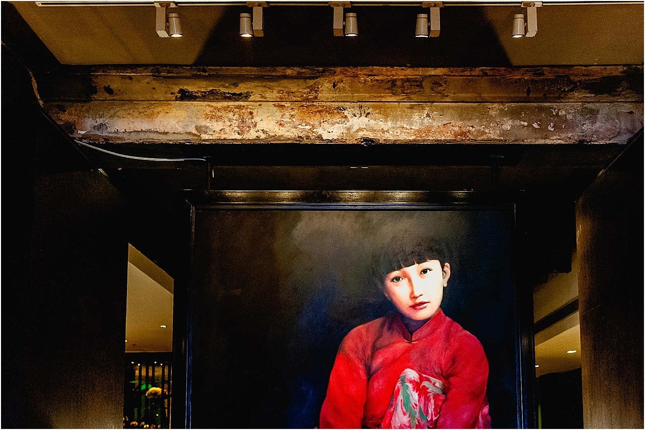 large painting of Thai girl in foyer on Shanghai Mansion Hotel in Bangkok