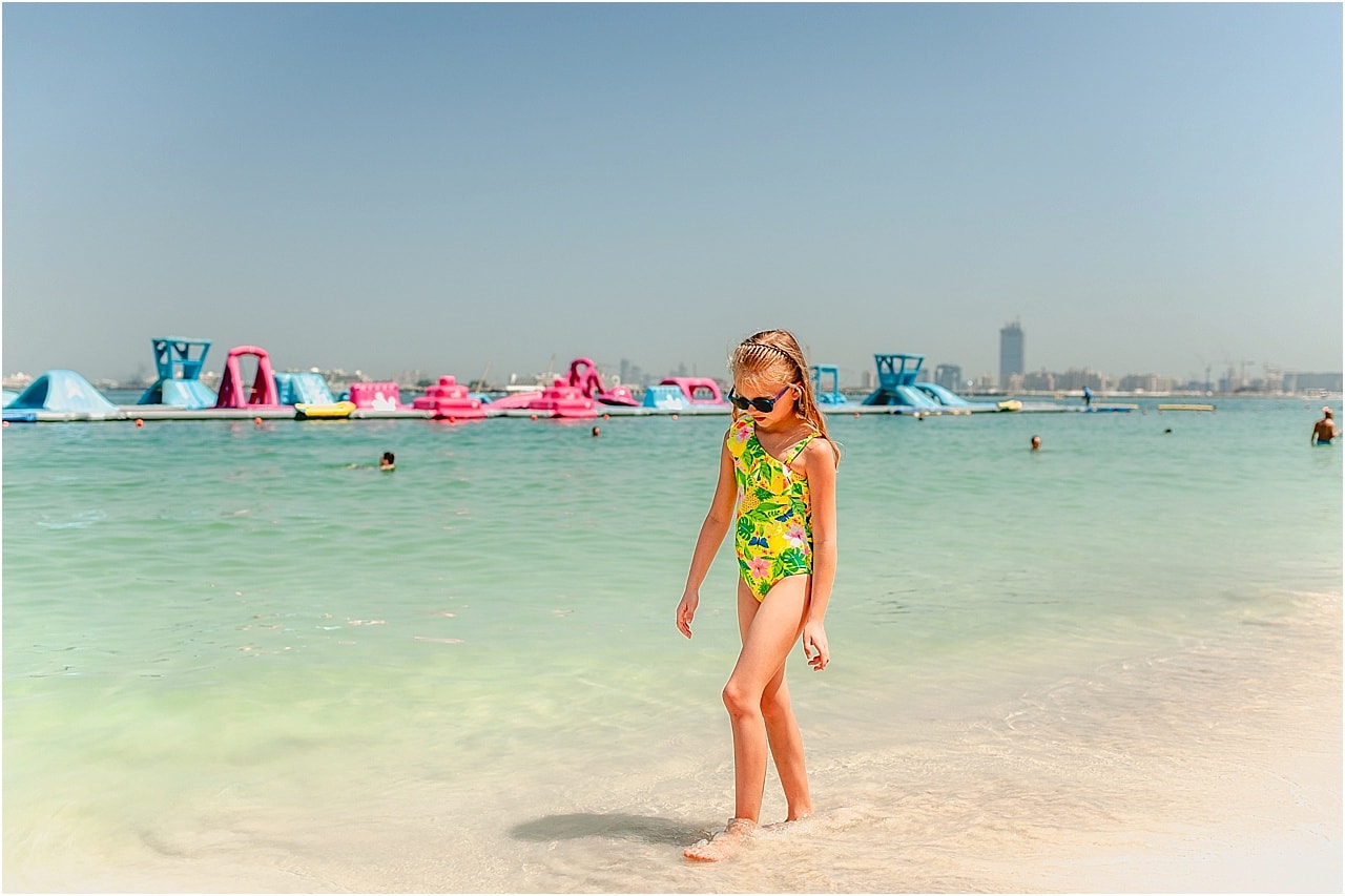 Girl walking along Jumeirah Beach