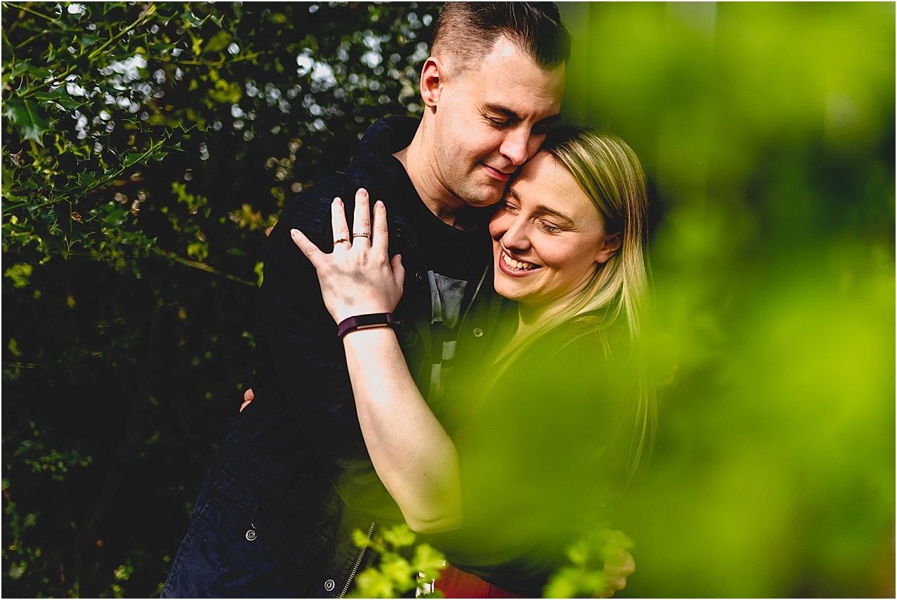 Engagement shoot in Jones Woods with Laura and Martin, couple cuddling in the woods
