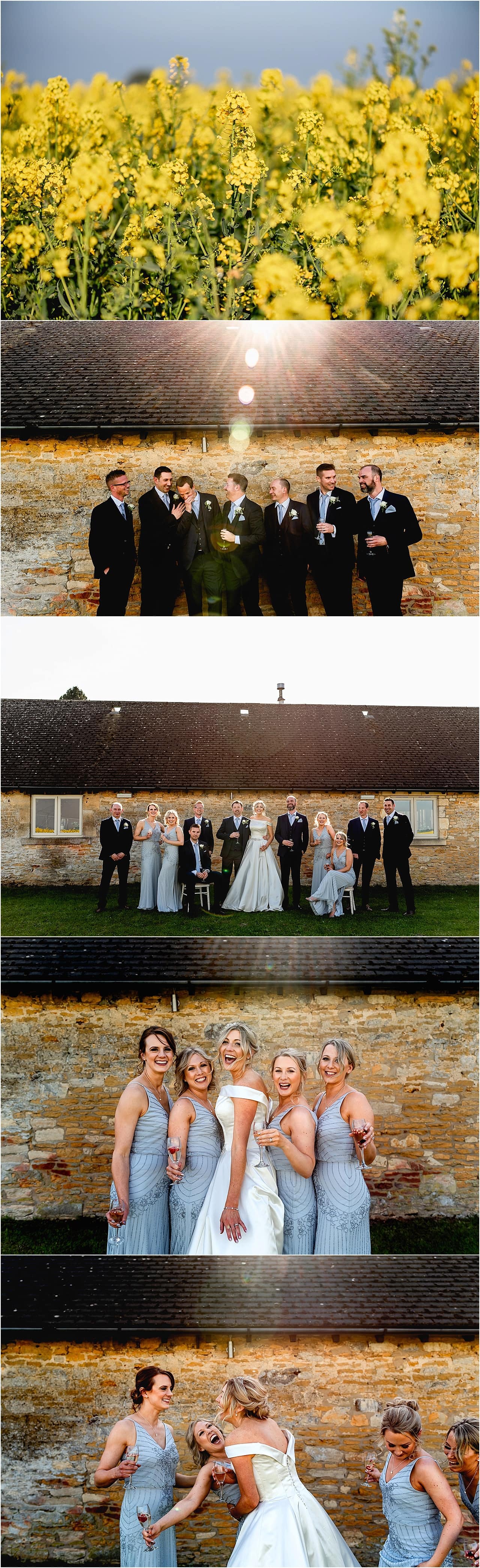 Bridal party photos at Lapstone Barn set against cotswolds brick wall ; bridesmaids wearing grey dresses laughing with bride.