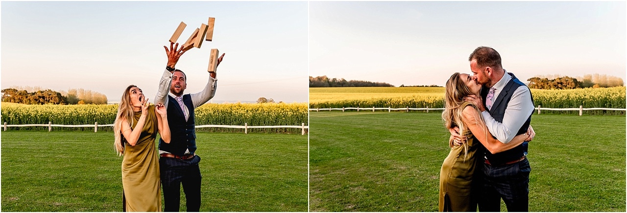 Wedding guests throw Jenga blocks into the air before kissing.