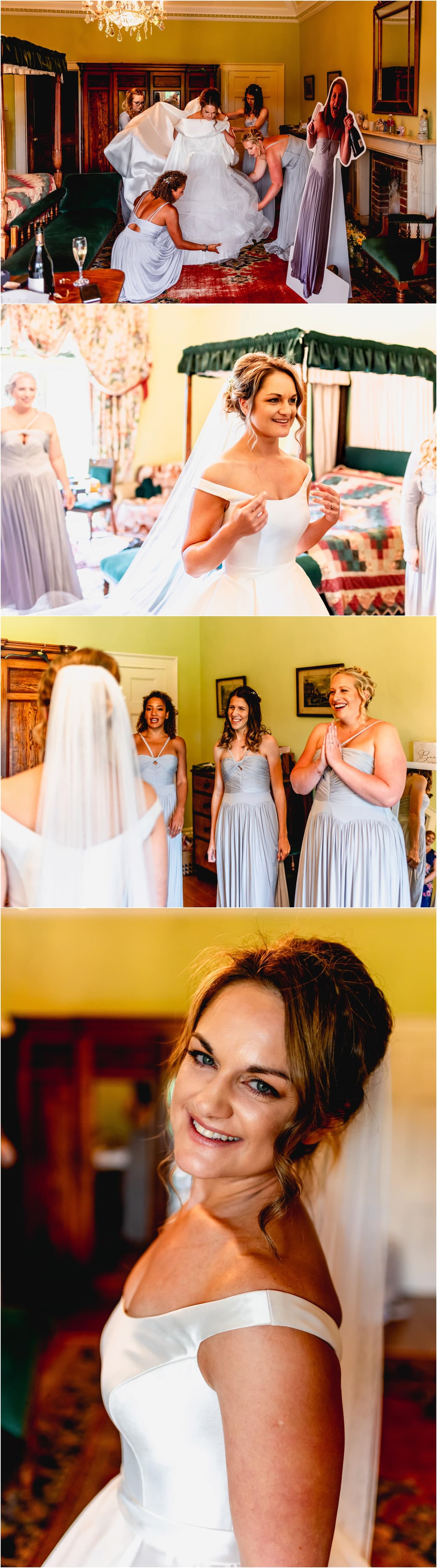 Bride and bridesmaids at Buckland House before a wedding, bridesmaids help bride get dressed.