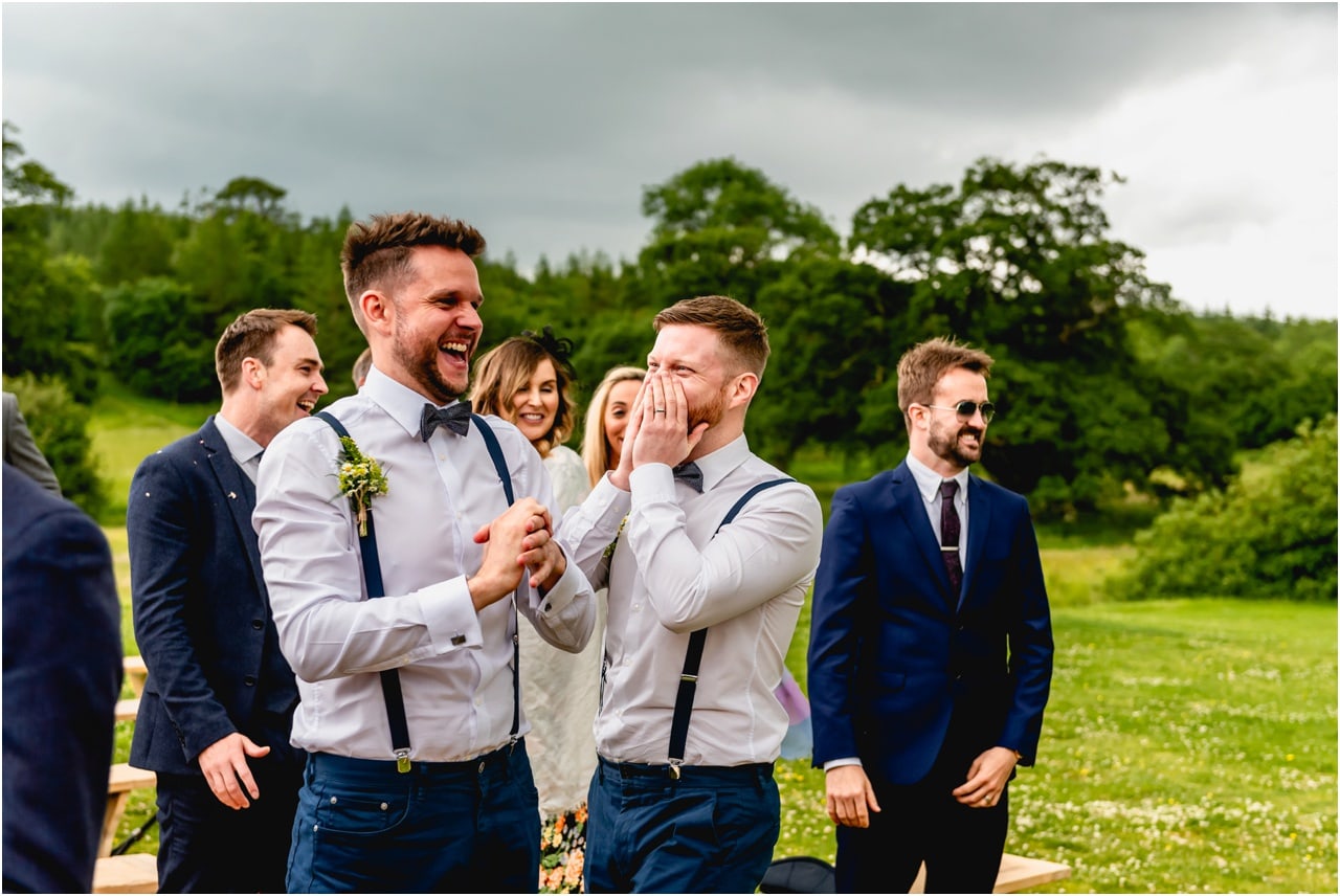 Ushers laughing at bride and groom at Buckland House.