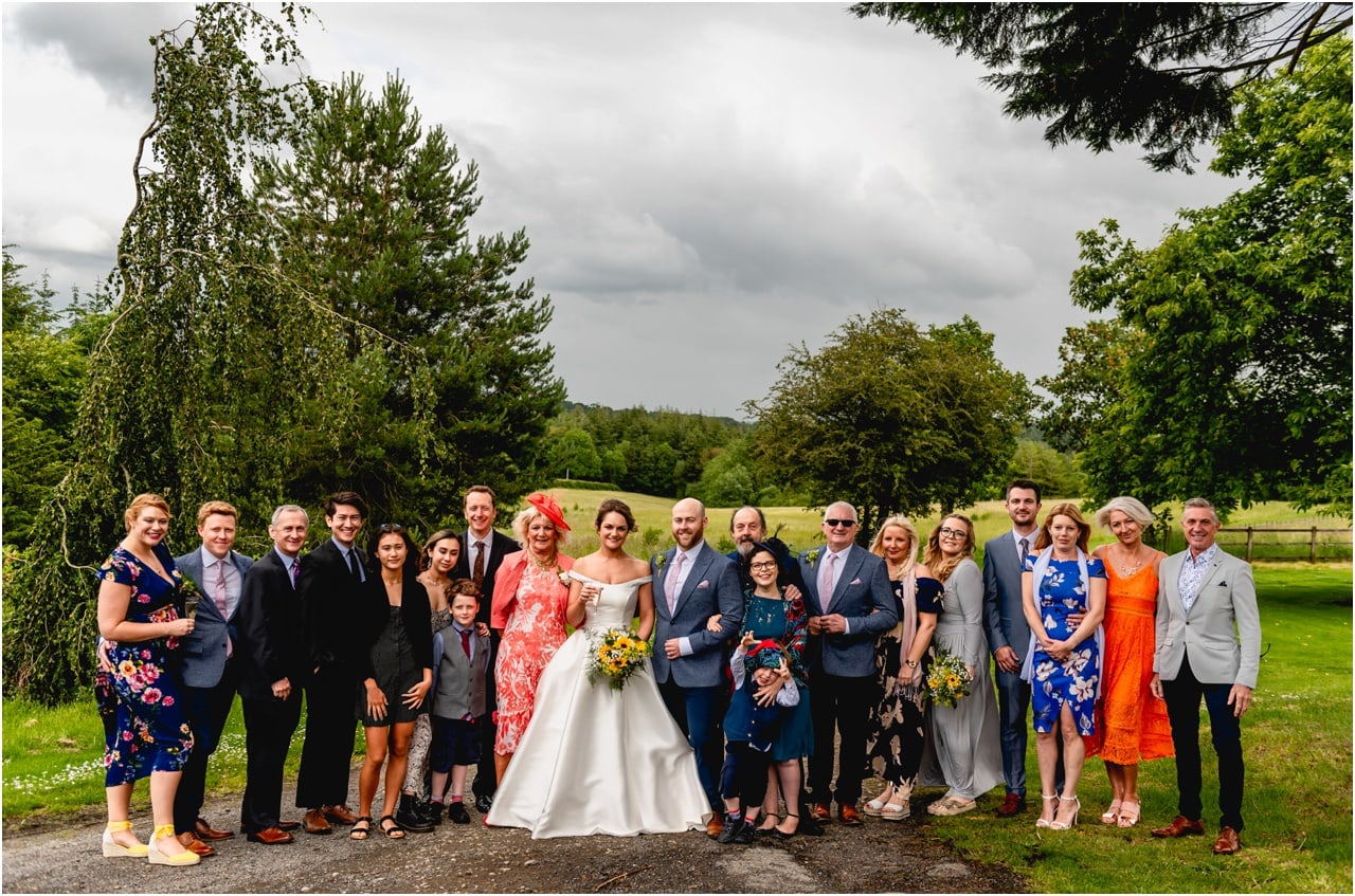 Group photo on the driveway of Buckland House in Devon at a wedding.