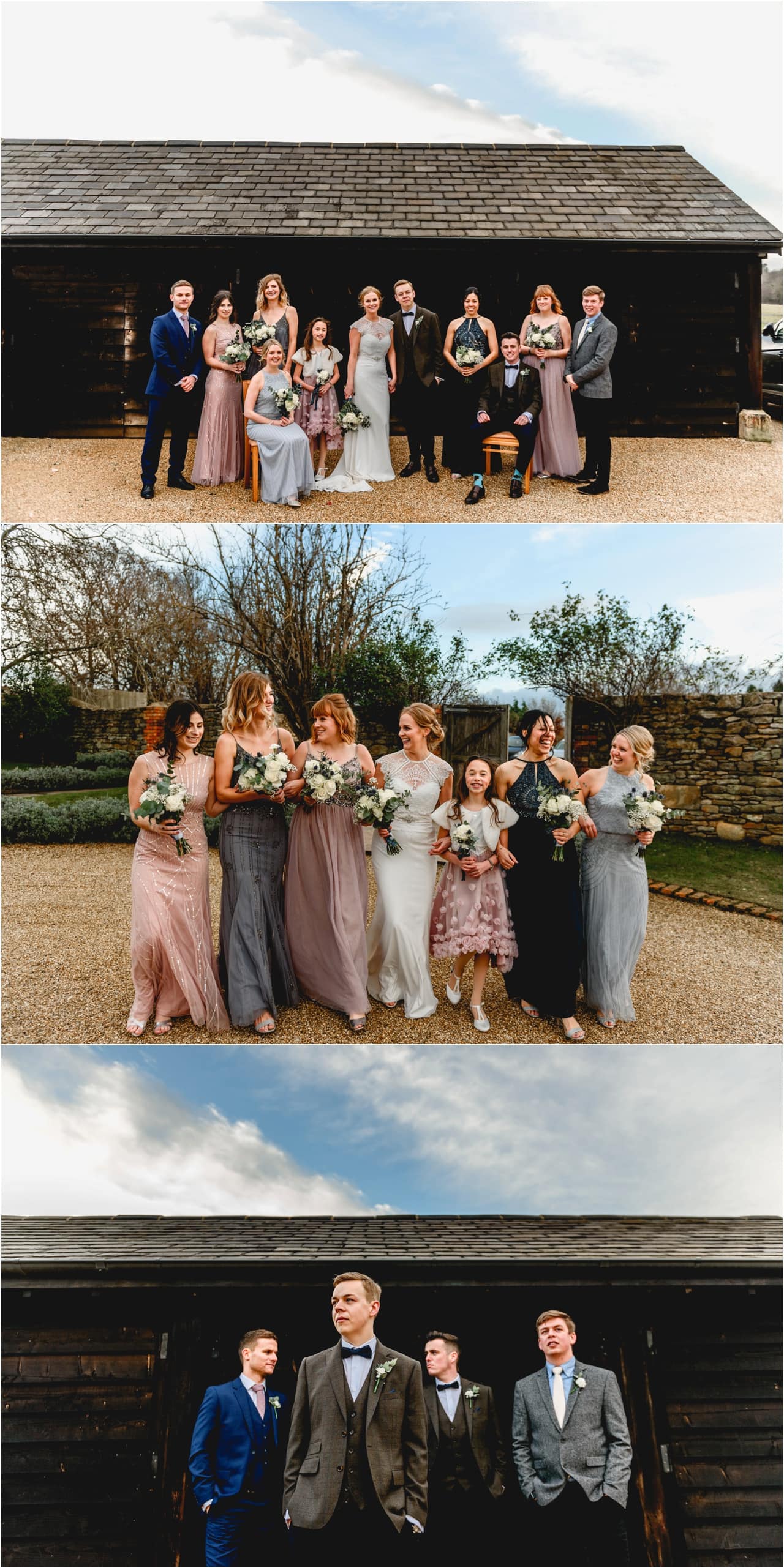 Bridal party of bride, groom, bridesmaids and ushers stand against black barn at Dodford Manor