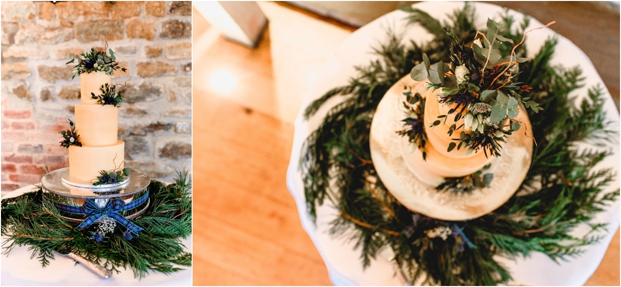Wedding cake with green holly details and blue tartan ribbon.