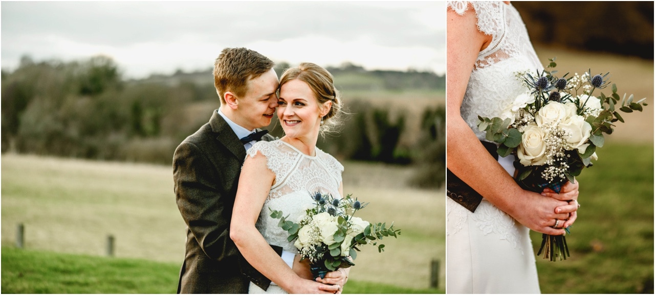 Bride and groom in a field holding bridal bouquet.