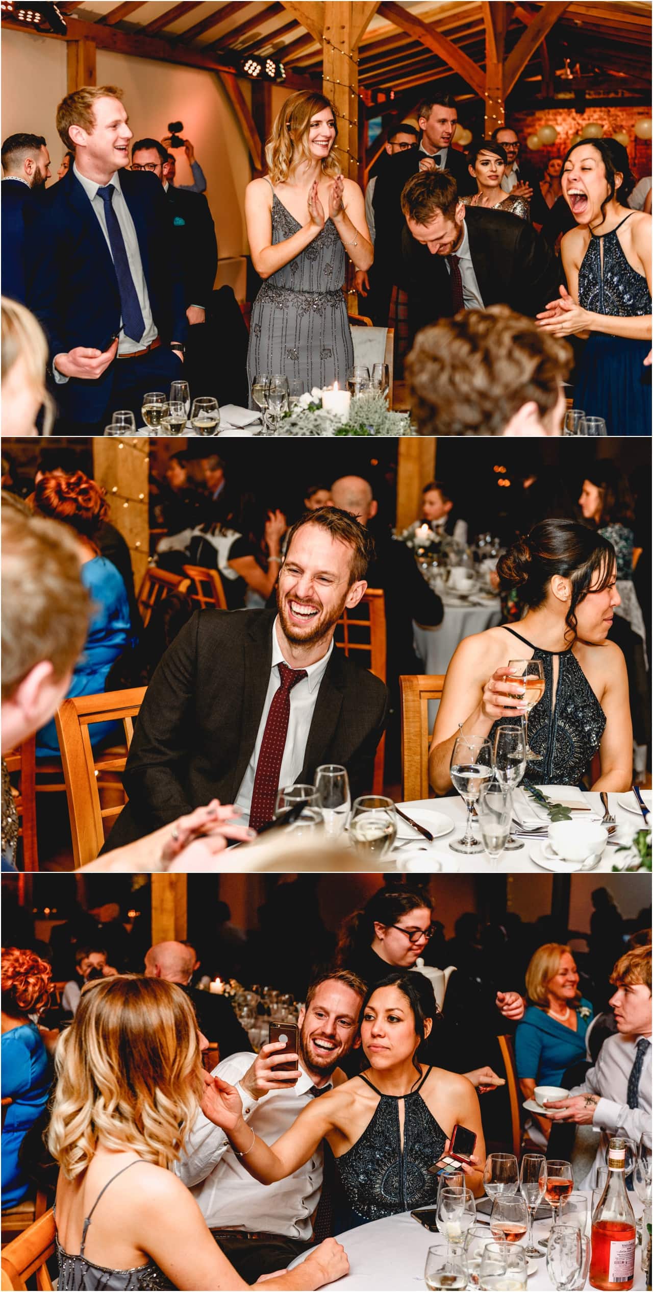 Guests laugh during wedding reception at Dodford Manor.