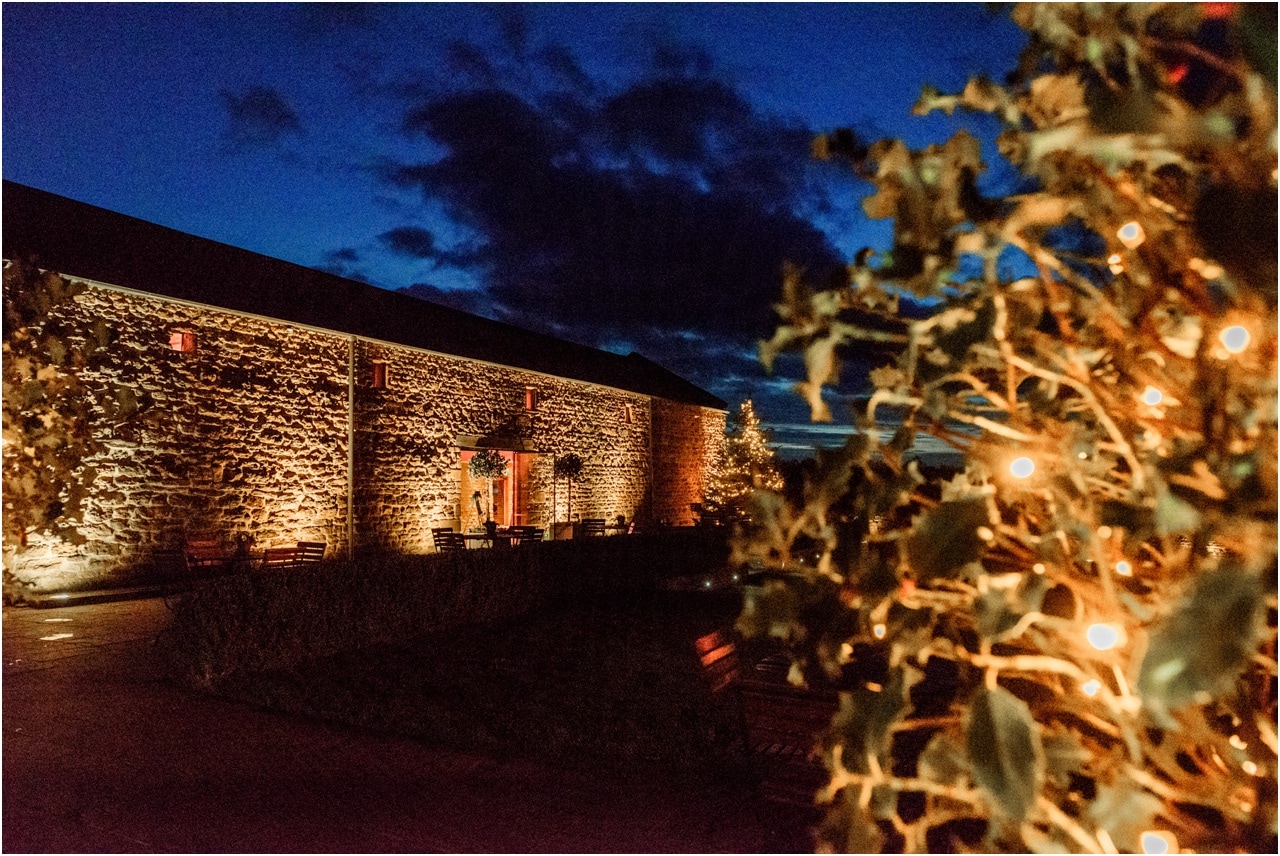 Night time photograph of the exterior of Dodford Manor in Northampton in December.