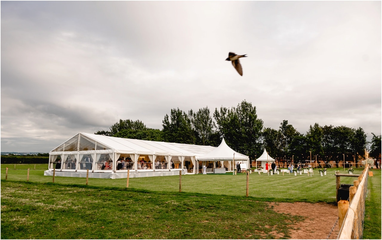 Exterior shot of a marquee set up for a wedding by Alcott Weddings in Sutton Coldfield on the back garden of a family home.