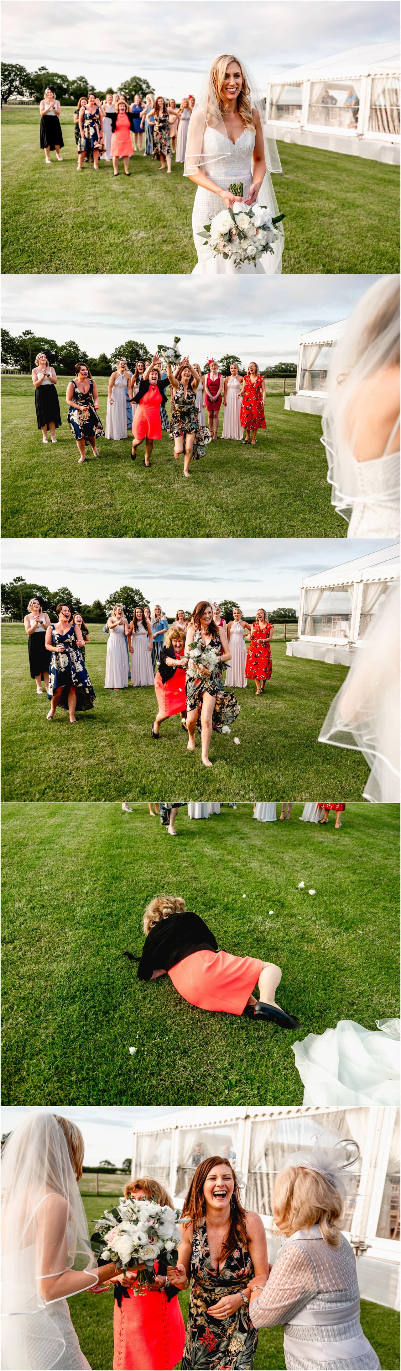 Throwing the bouquet at a wedding in Sutton Coldfield with guests jumping and fighting for the bouquet.