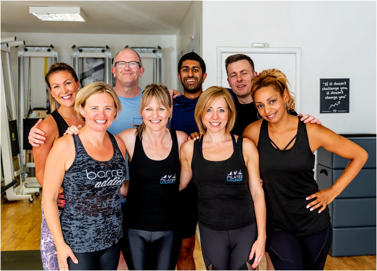Group of happy students at Pilates Lounge. Small business photography.