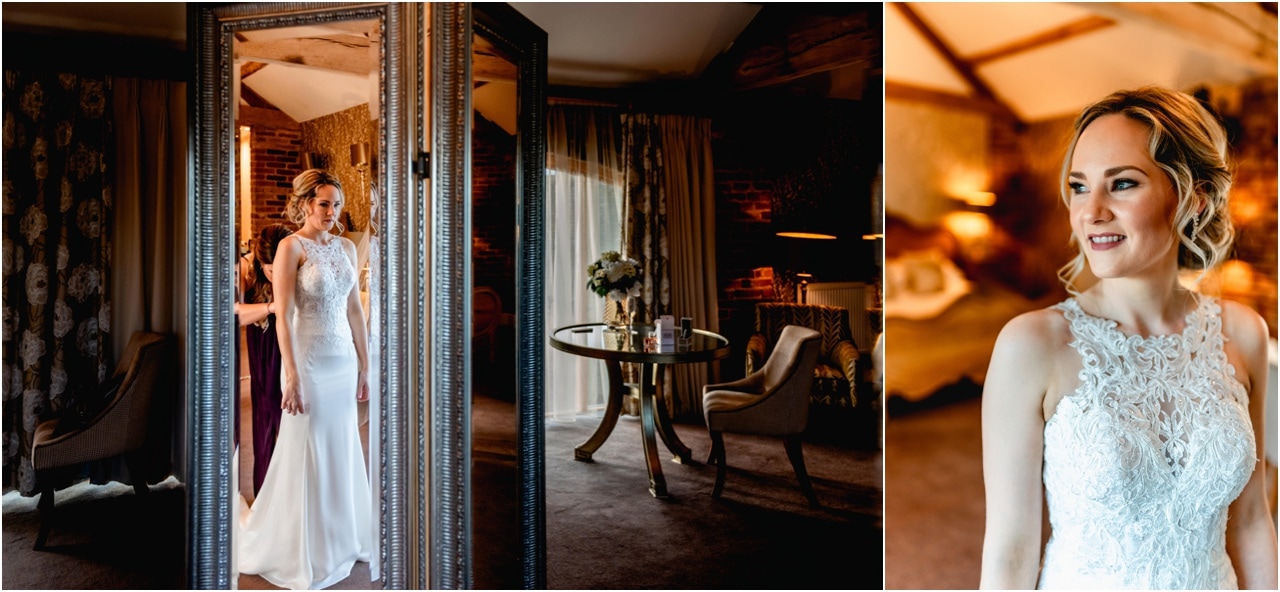 Bridal Suite at Mythe Barn in Nuneaton, bride puts wedding dress on and sees reflection in full length mirror.