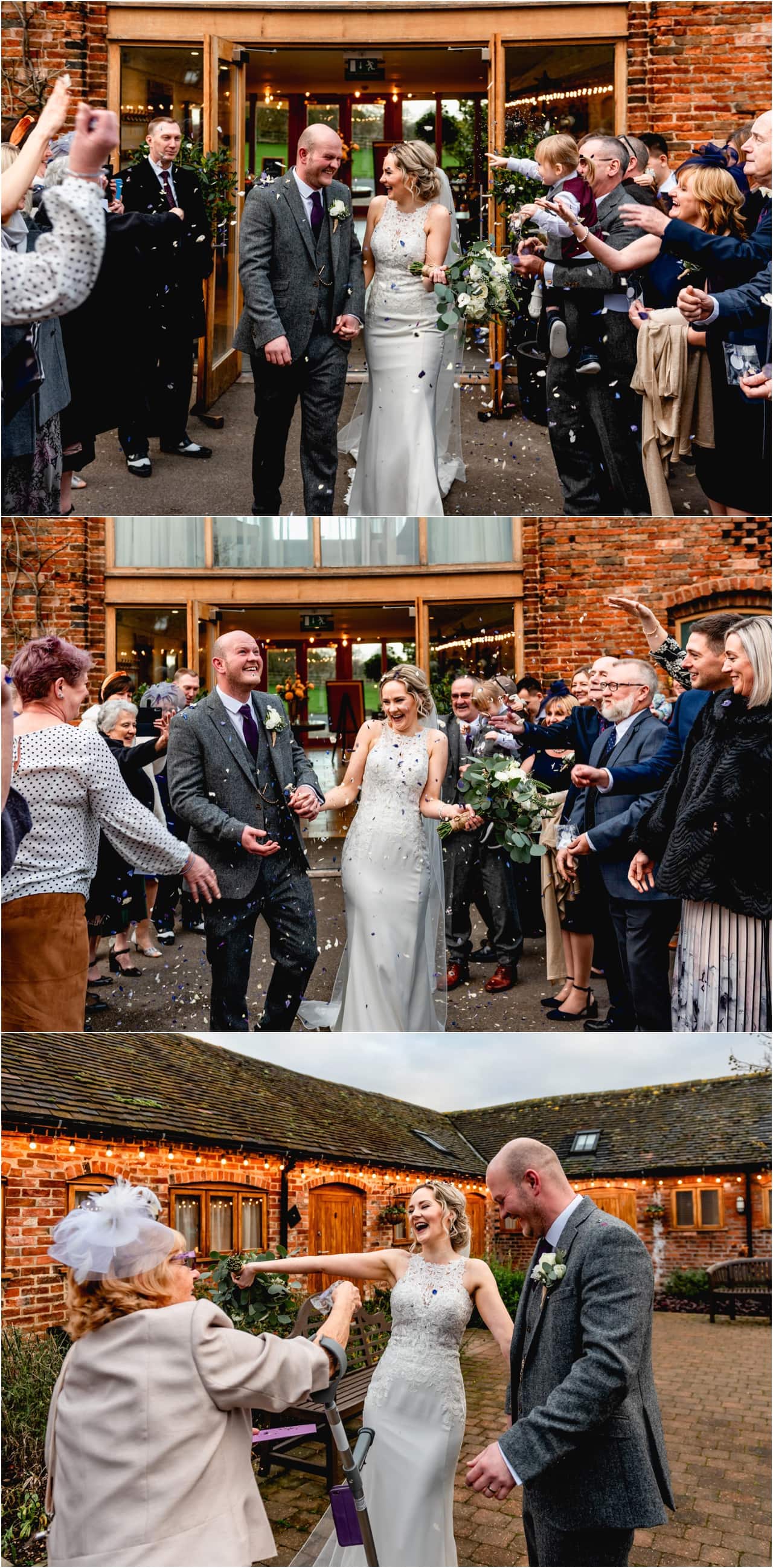 Confetti tunnel walk with bride and groom outside during winter wedding at Mythe Barn.