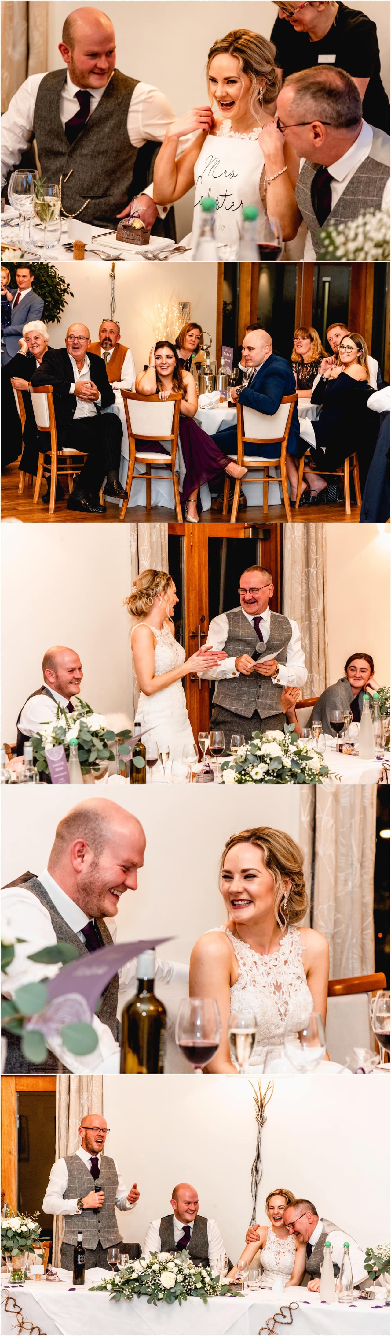 Wedding speeches at a wedding reception - bride and her Dad laugh together.