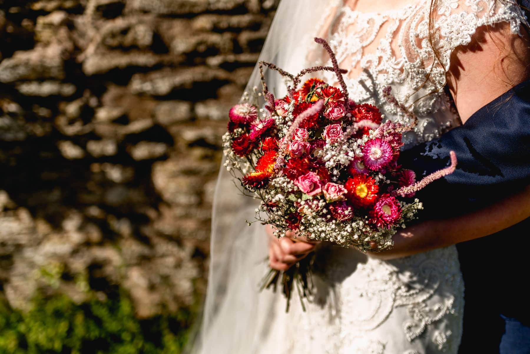 Brides bouquet of red and pink flowers
