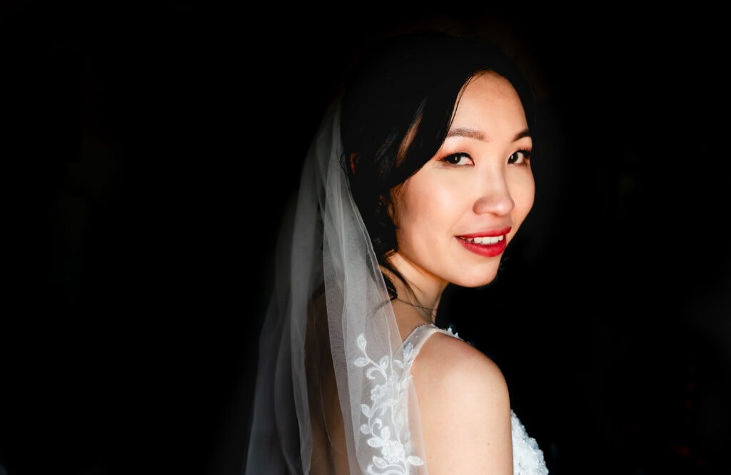 Portrait of bride looking over her shoulder
