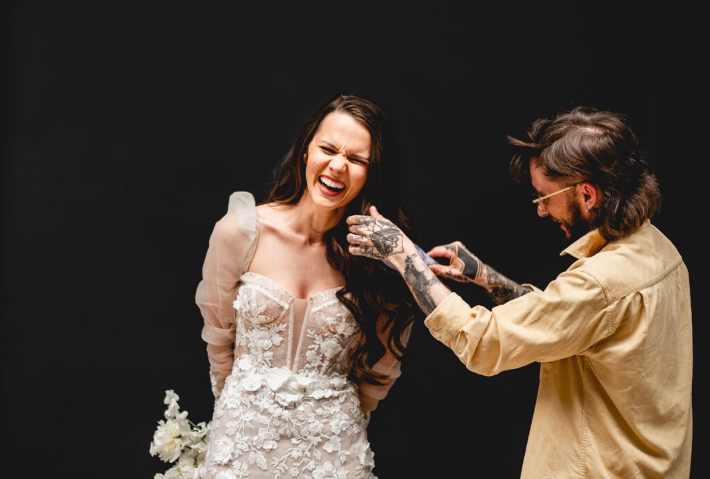 hairstylist daryl Knox preps a brides hair for her photos, Berta bridal dress