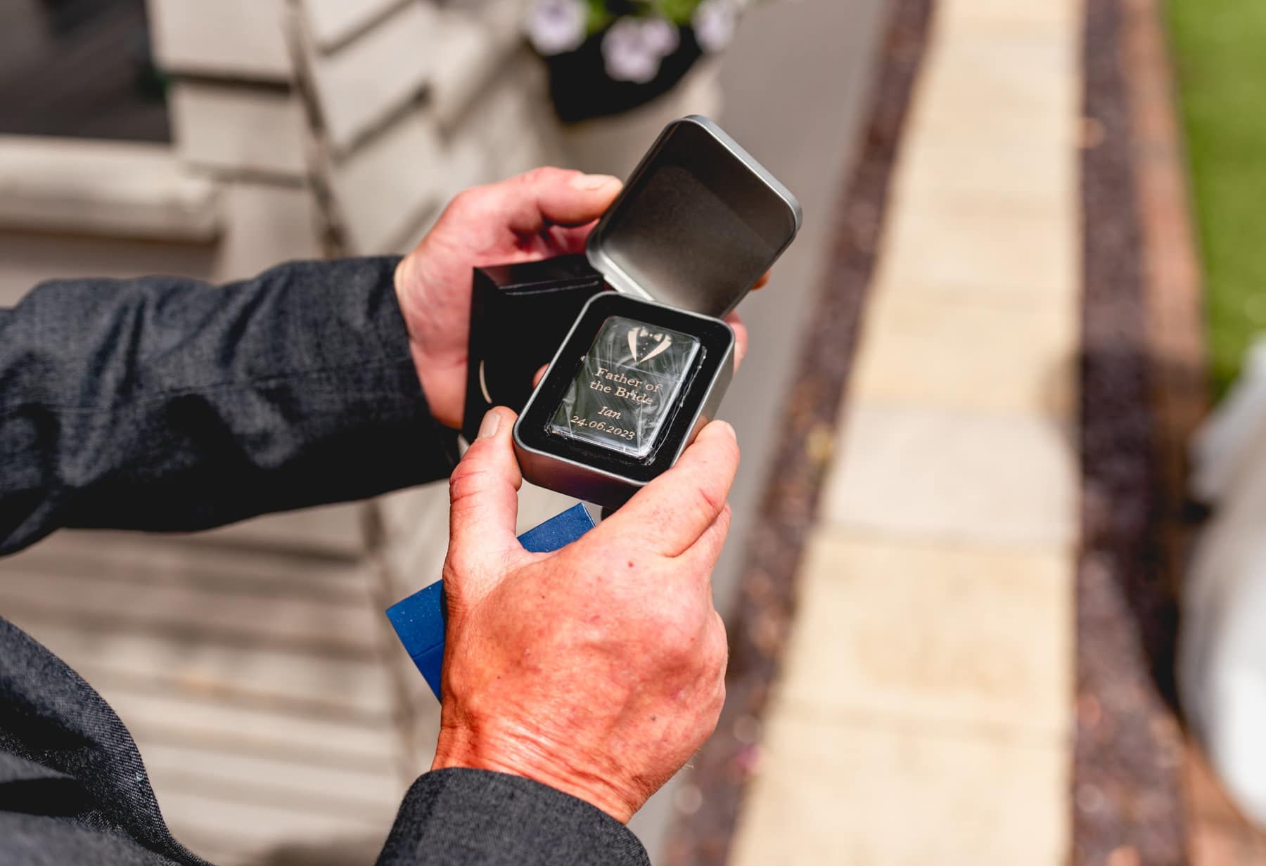 Dad opens cufflinks, a gift from the bride, his daughter before their Fazeley Studios Wedding