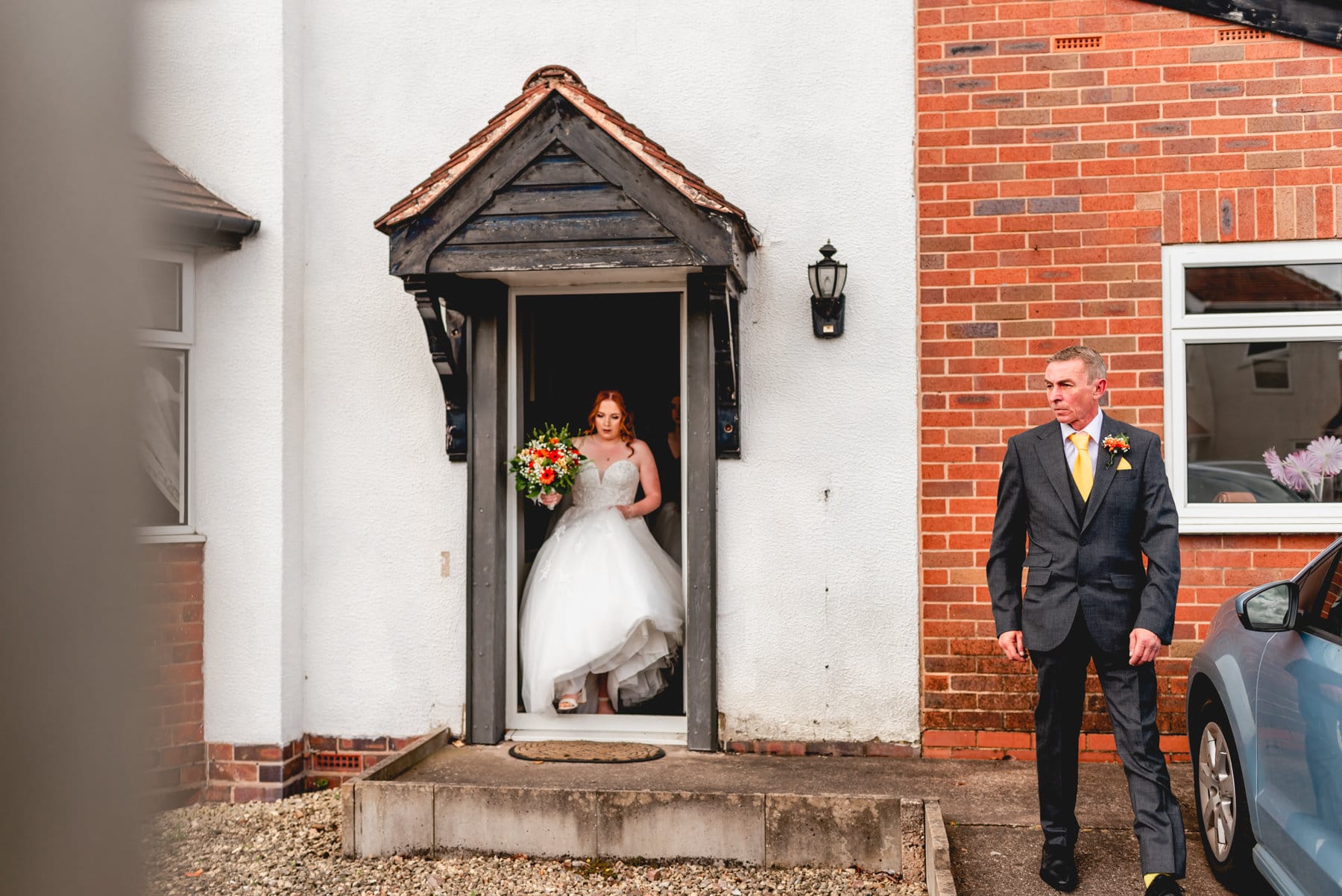 Bride leaves her house on the morning of wedding while her father waits