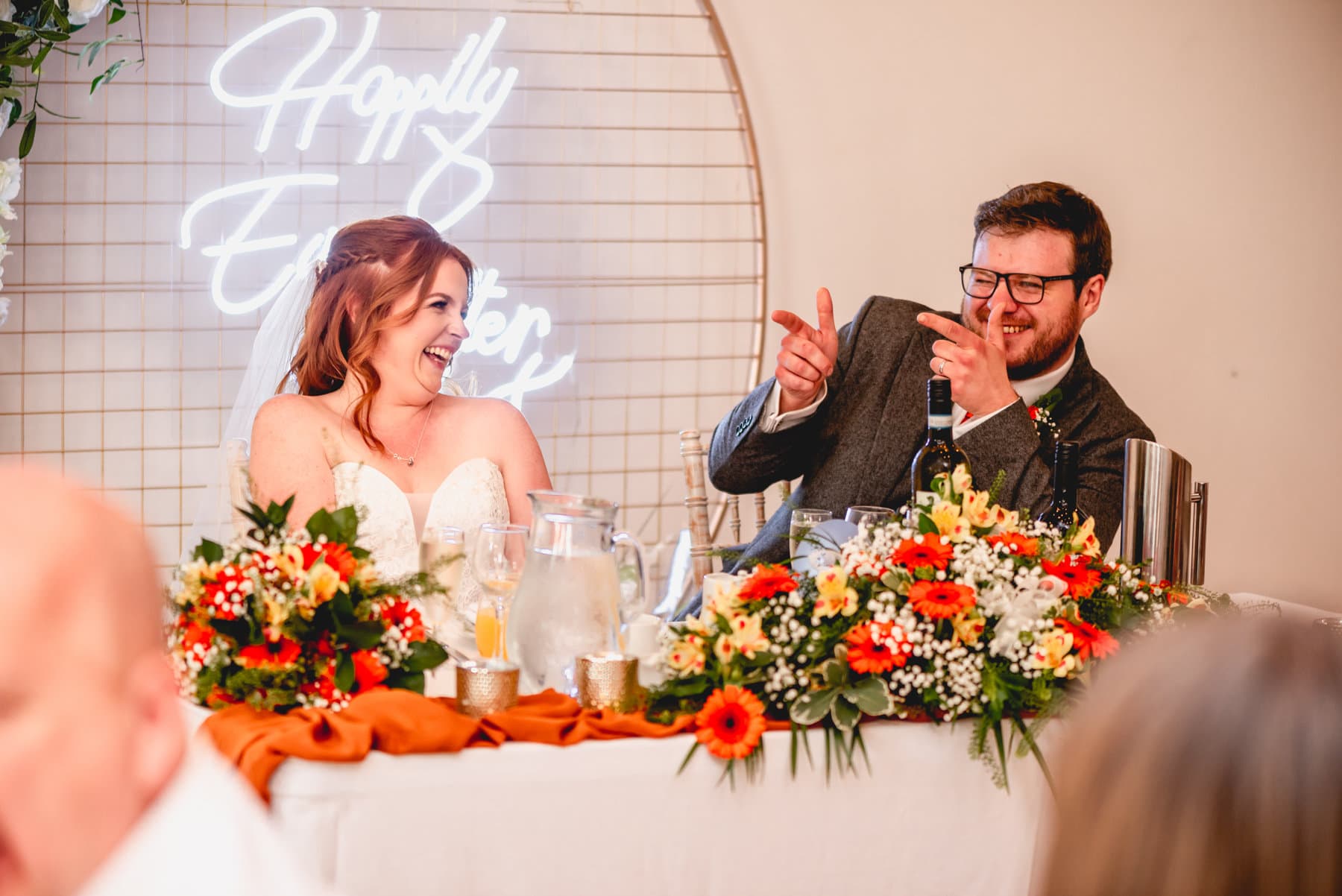 Groom finger guns the father of the bride