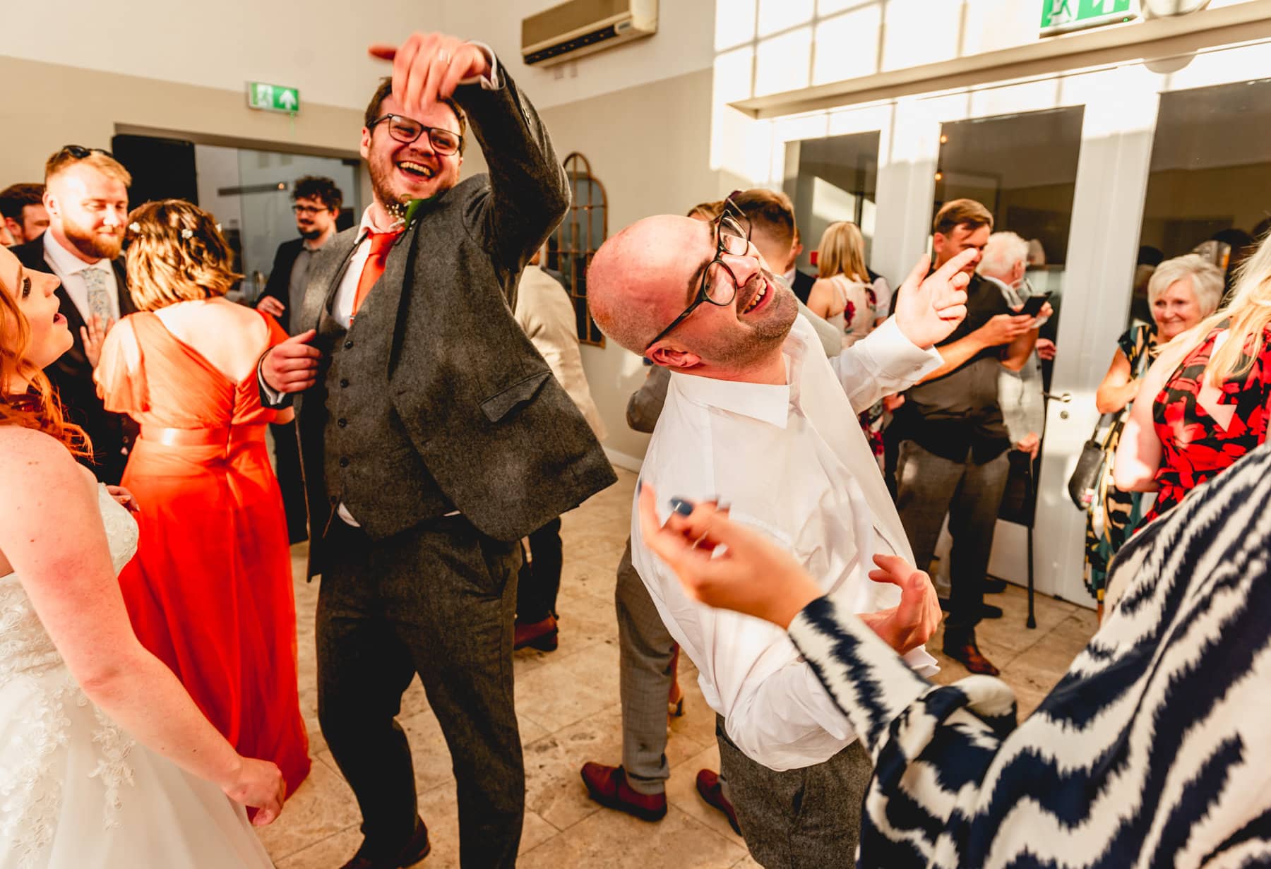 Men on the dance floor at a wedding at Fazeley Studios