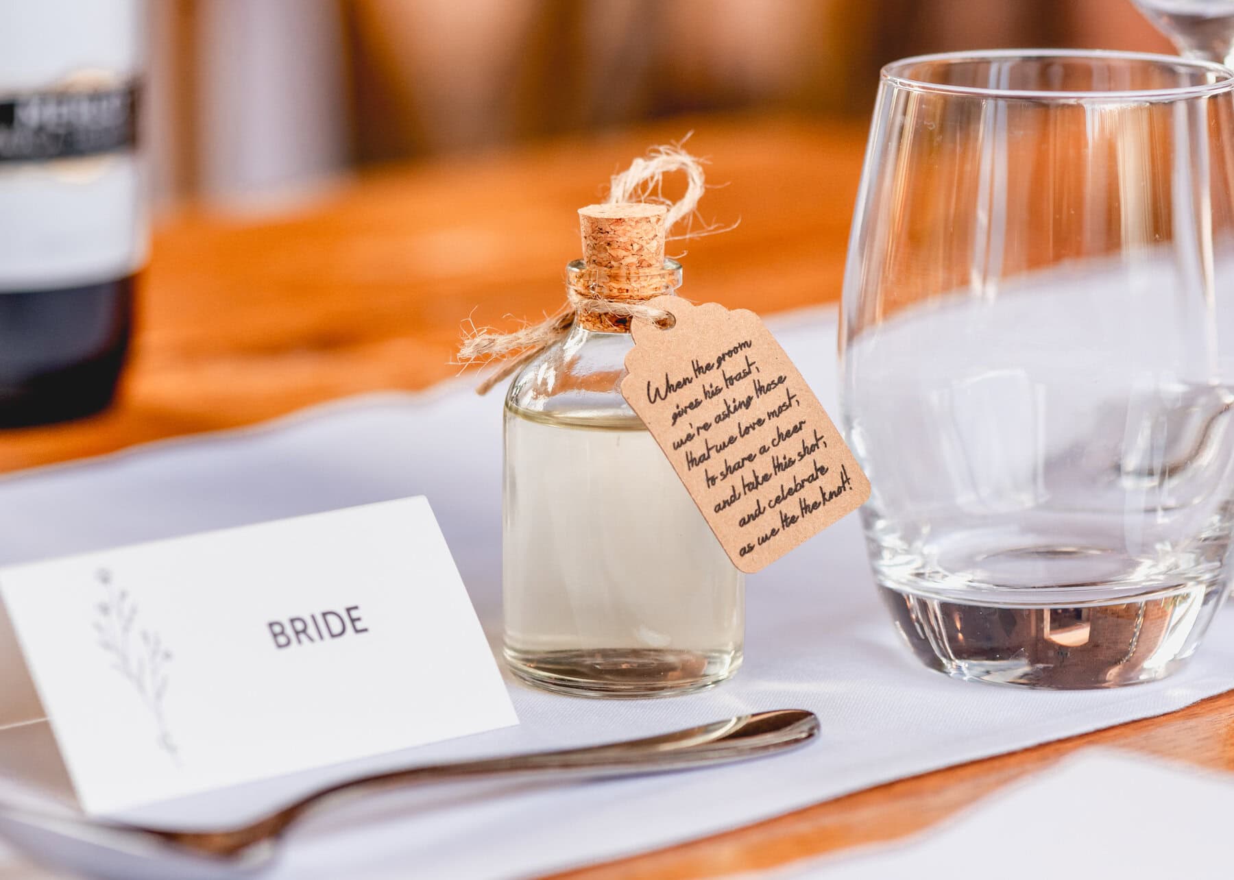 Small bottle of alcohol at a wedding on the table for guests to enjoy