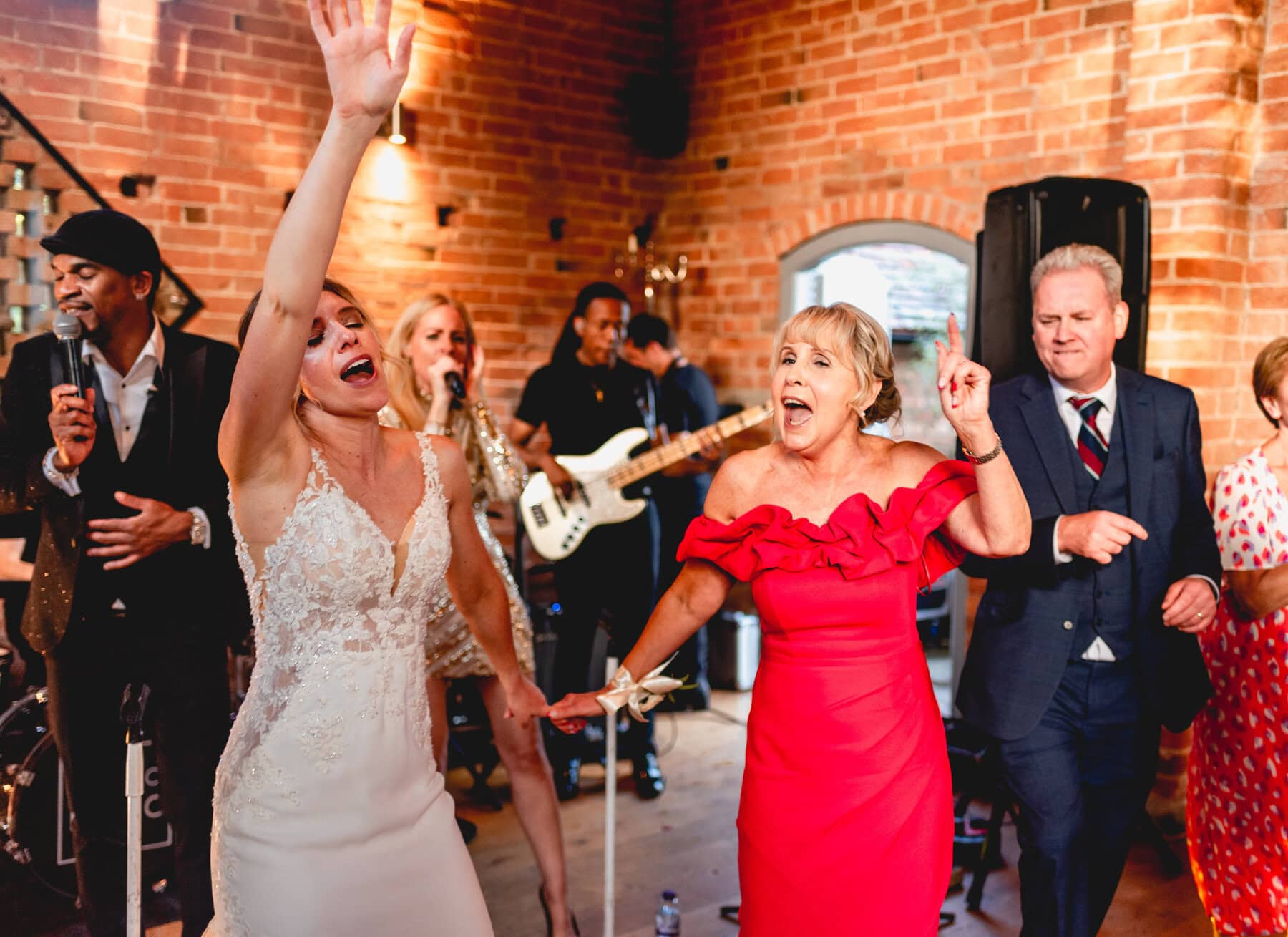 Bride and her Mom dance at a wedding at Swallows Nest Barn
