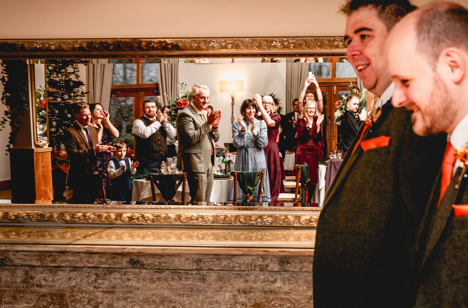 Couple enter the wedding breakfast room, while guests cheer, 2025 - The Weird and Wonderful Year of Weddings