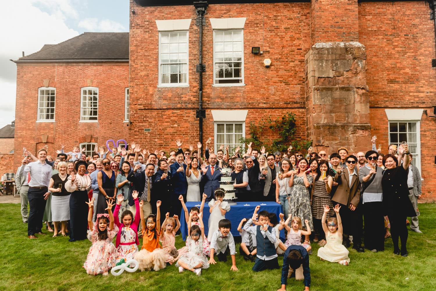 Group photo of bride and groom and at guests at their wedding at Blyth Hall, 2025 - The Weird and Wonderful Year of Weddings