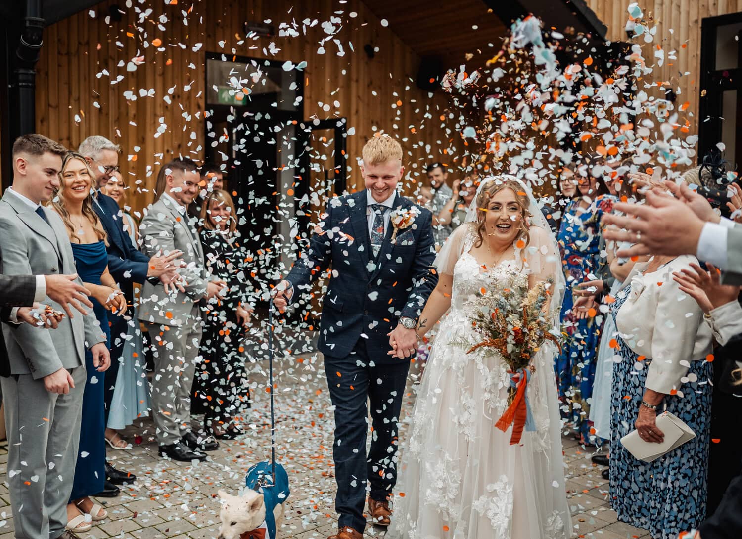 Confetti toss at Blackbrook Barns, couple with dog. 2025 - A Weird and Wonderful Year of Weddings